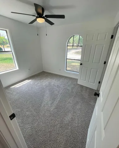 a view of empty room with windows