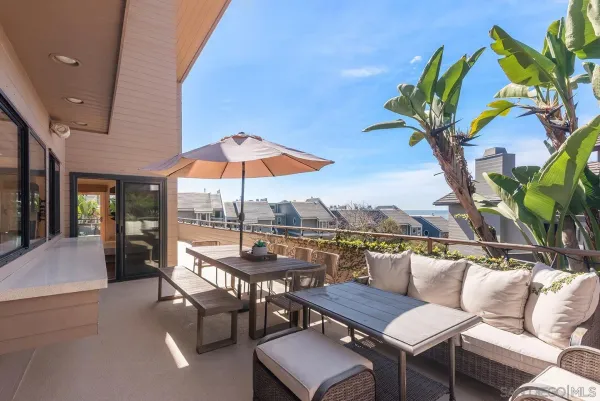 a view of a balcony with chairs