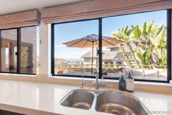 a bathroom with a sink and a large window