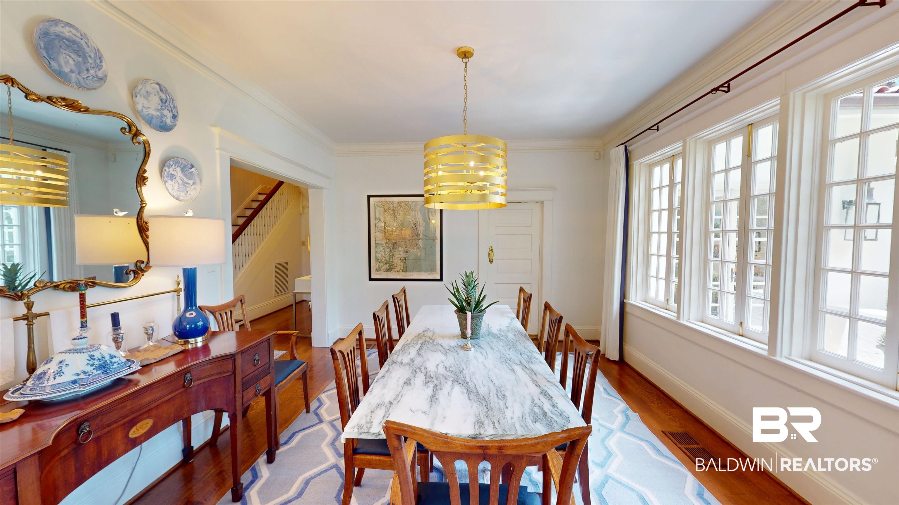 211 Lanier Avenue Mobile, AL 36607 - Photo 26 of 73 Dining room with wood finished floors, a chandelier, ornamental molding, and stairway