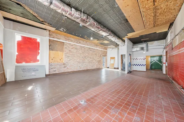 a view of a room with wooden walls