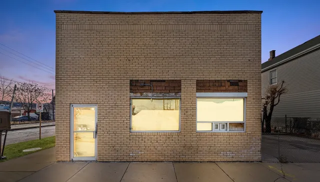 a brick house with a large door