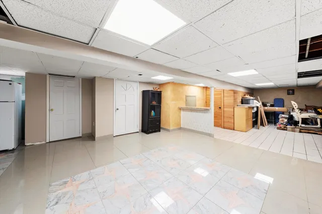 a view of a livingroom with furniture and a window