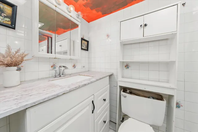 a view of a hallway with wooden shelves