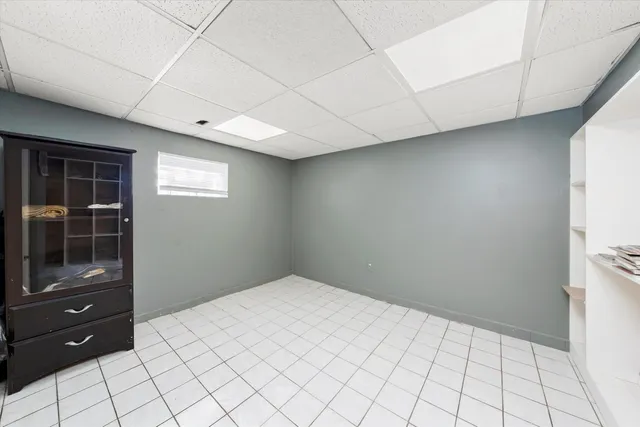 a large kitchen with stainless steel appliances cabinets a sink and a stove