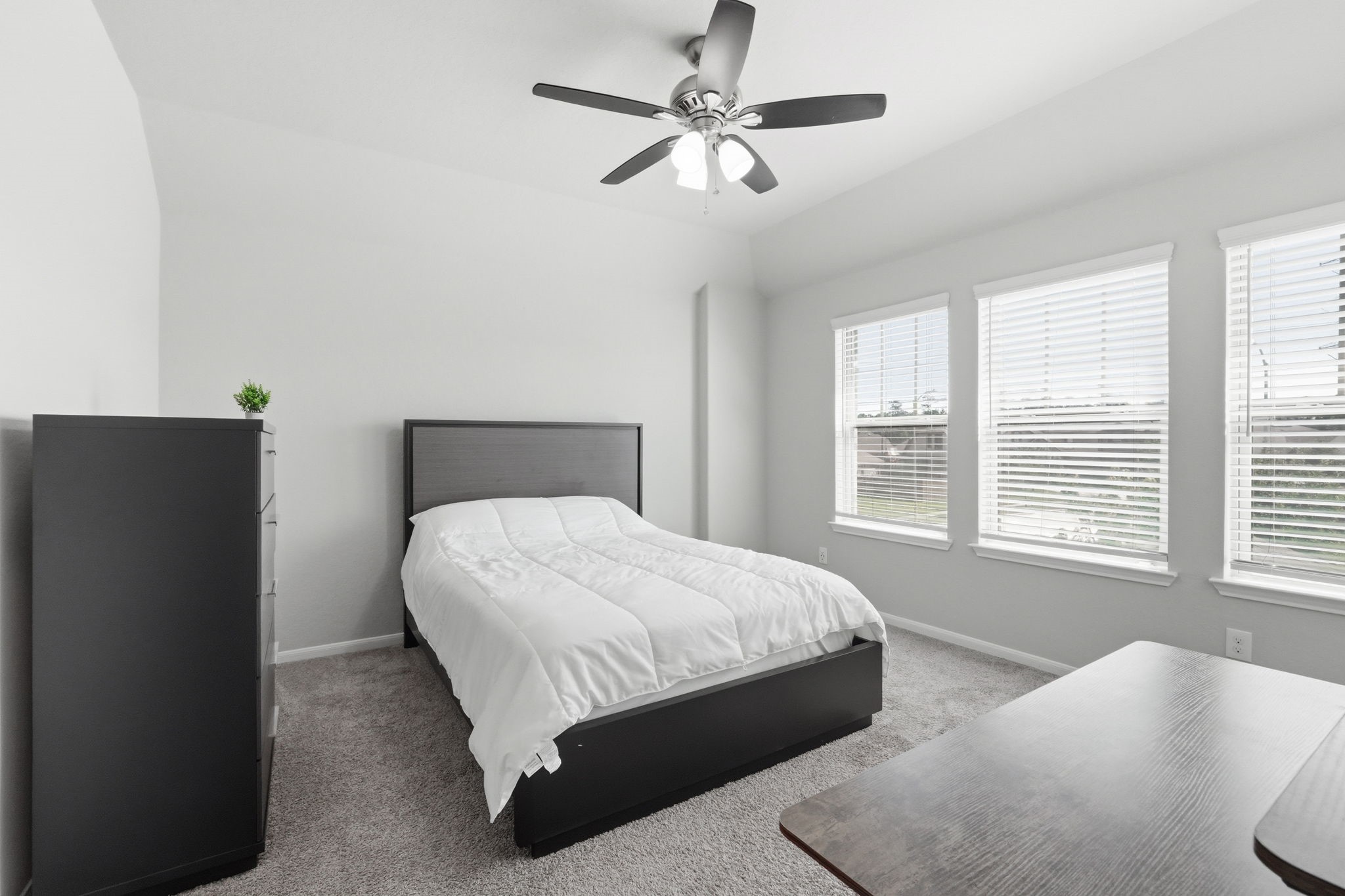 4334 Umber Shadow Drive Spring, TX 77386 - Photo 25 of 45 Secondary bedroom features multiple windows that bring in natural light and provide neighborhood views.