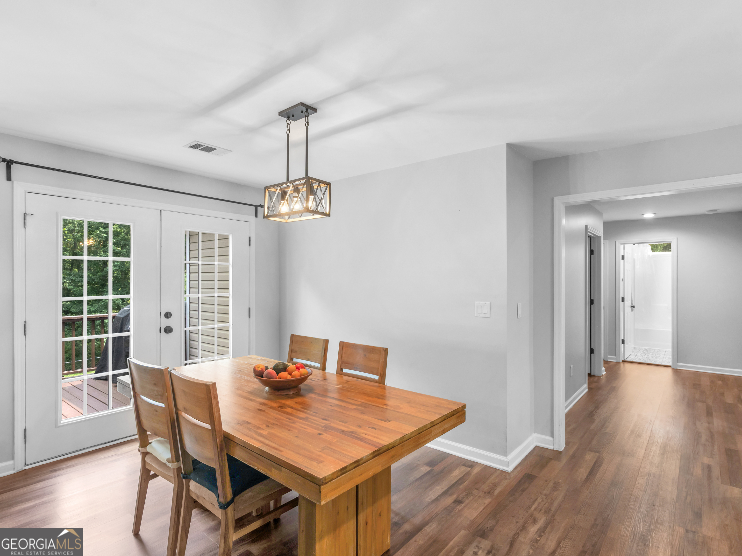 545 Barhams Ridge Drive McDonough, GA 30252 - Photo 16 of 55 a view of a dining room with a table and chairs