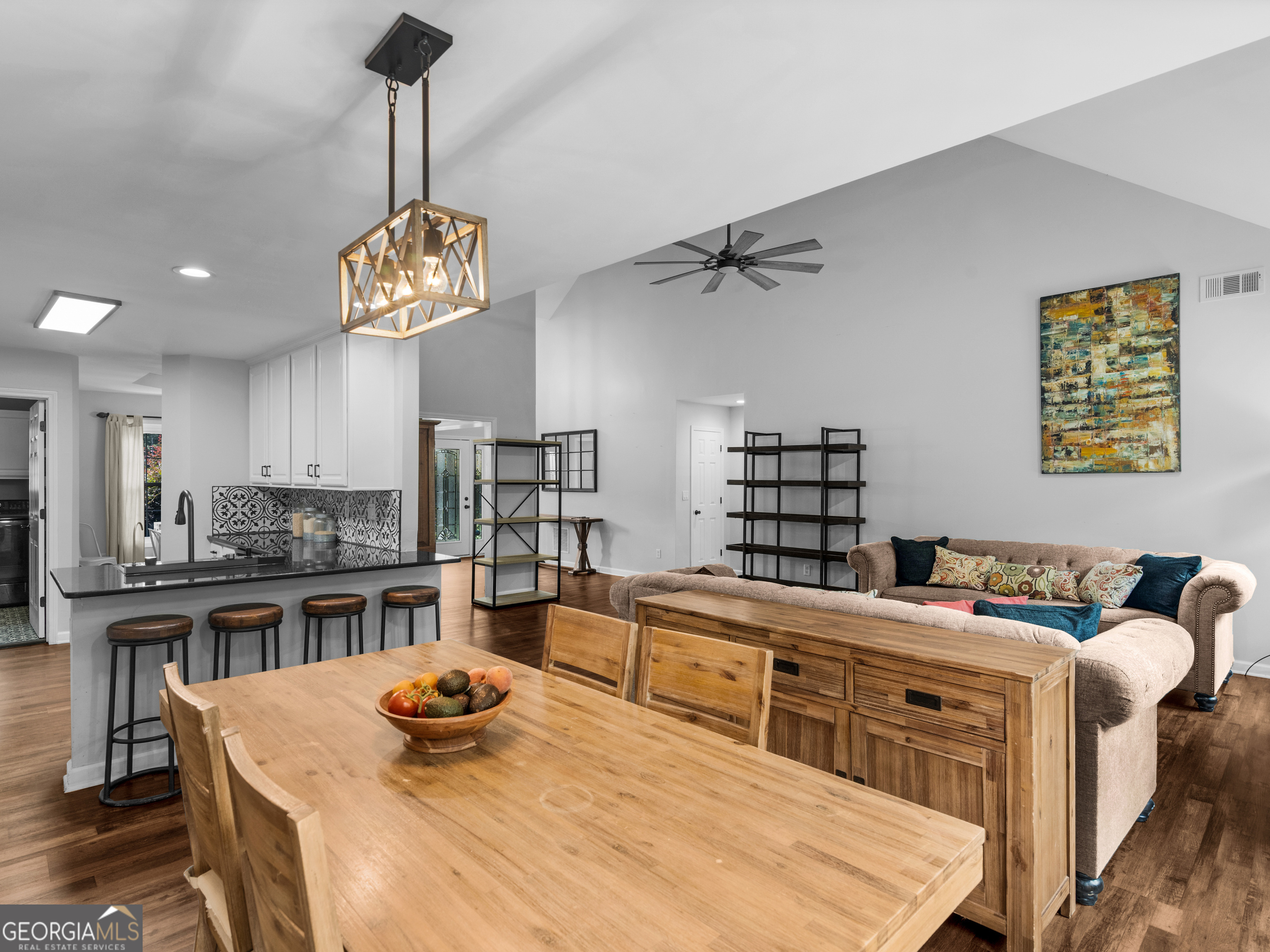 545 Barhams Ridge Drive McDonough, GA 30252 - Photo 18 of 55 a kitchen with a stove a table and chairs in it