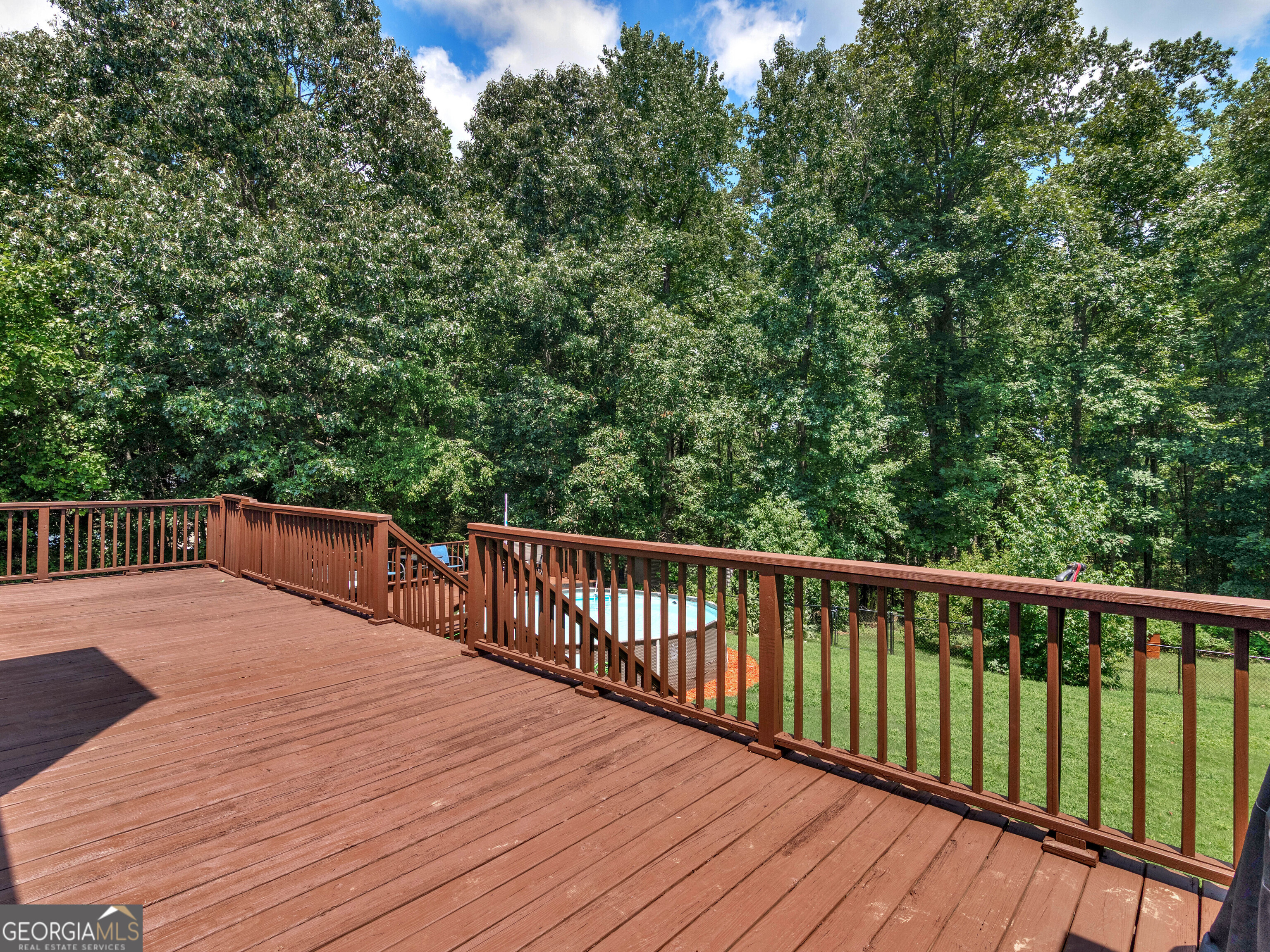545 Barhams Ridge Drive McDonough, GA 30252 - Photo 2 of 55 a balcony with wooden floor and fence