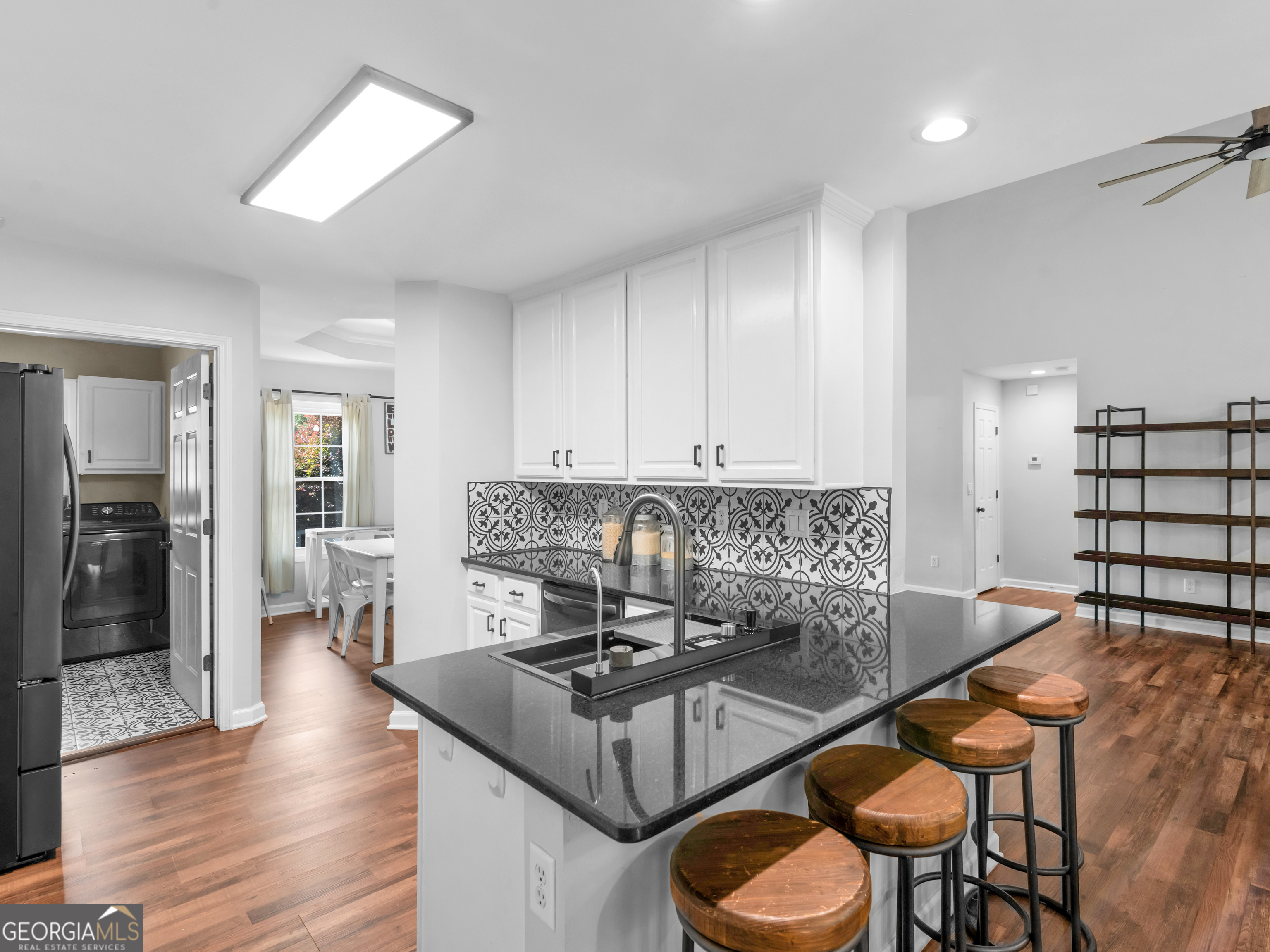 545 Barhams Ridge Drive McDonough, GA 30252 - Photo 21 of 55 a kitchen with granite countertop a stove and white cabinets