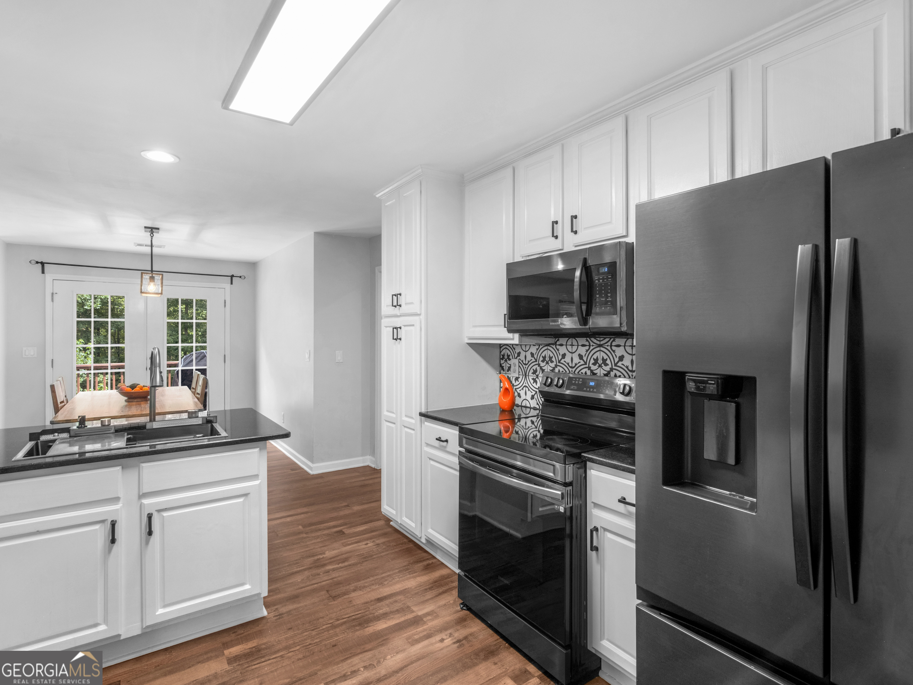 545 Barhams Ridge Drive McDonough, GA 30252 - Photo 24 of 55 a kitchen with a refrigerator and a sink