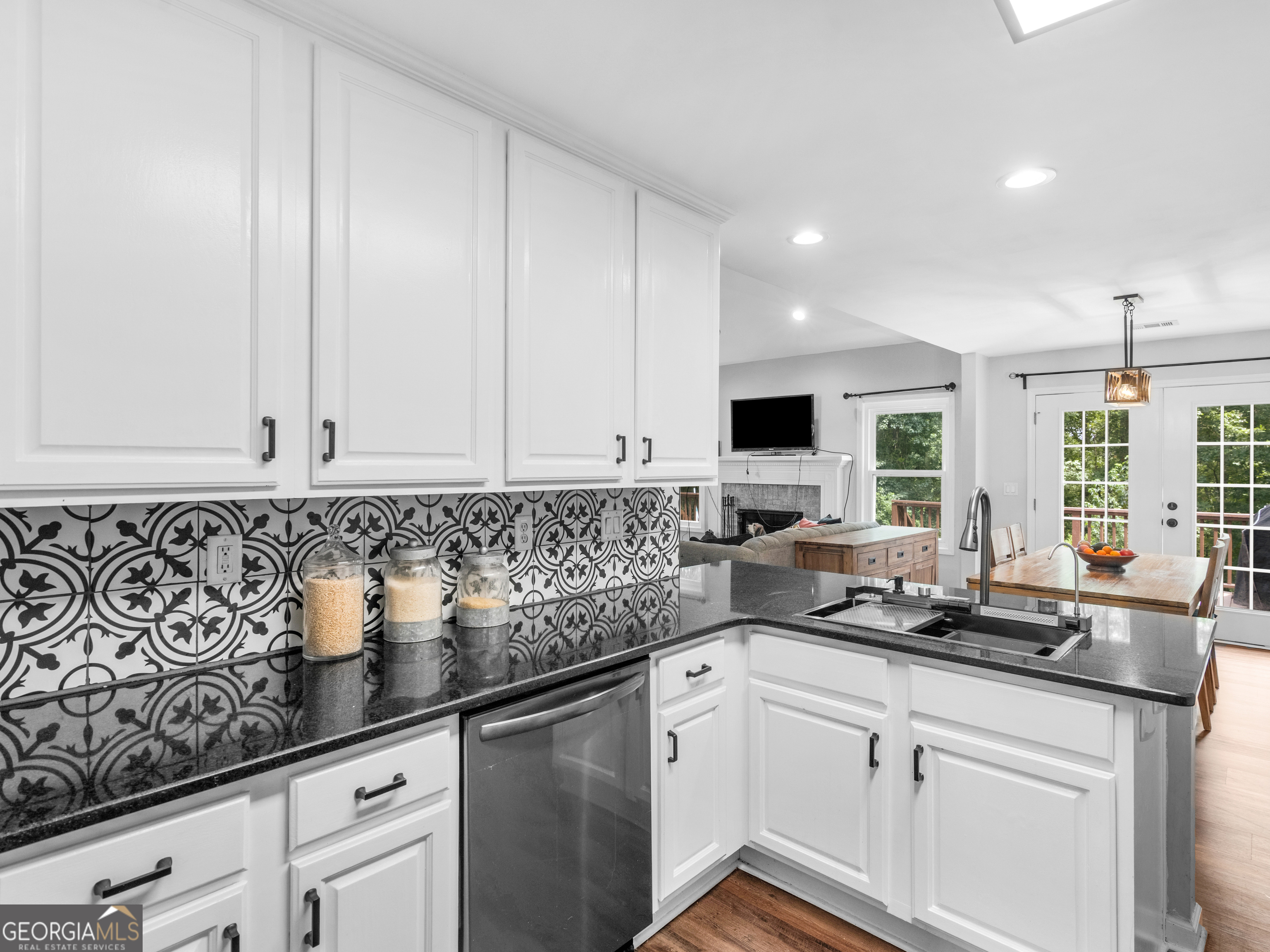 545 Barhams Ridge Drive McDonough, GA 30252 - Photo 25 of 55 a kitchen with stainless steel appliances granite countertop a sink a stove and a microwave