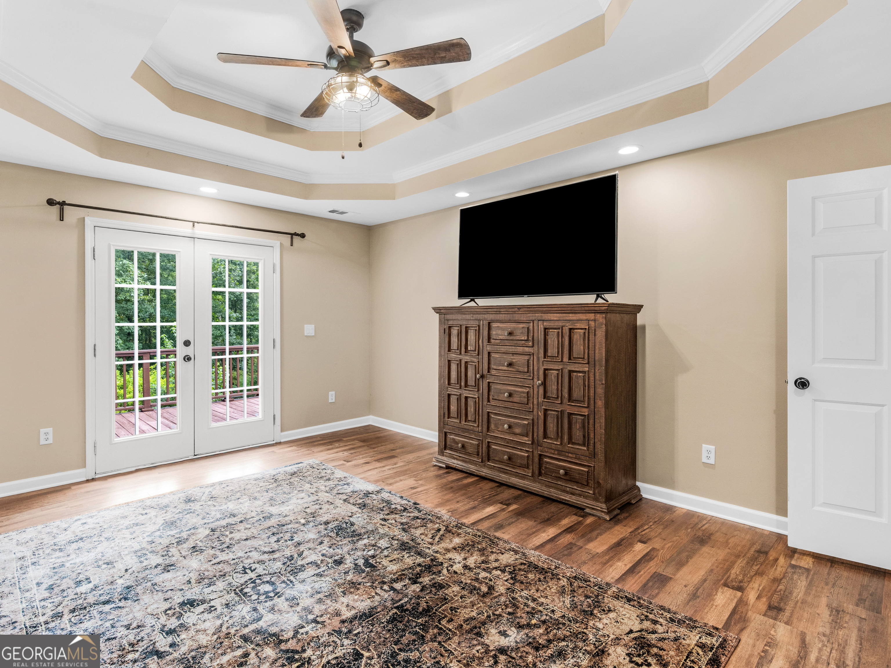 545 Barhams Ridge Drive McDonough, GA 30252 - Photo 27 of 55 a living room with furniture and a flat screen tv