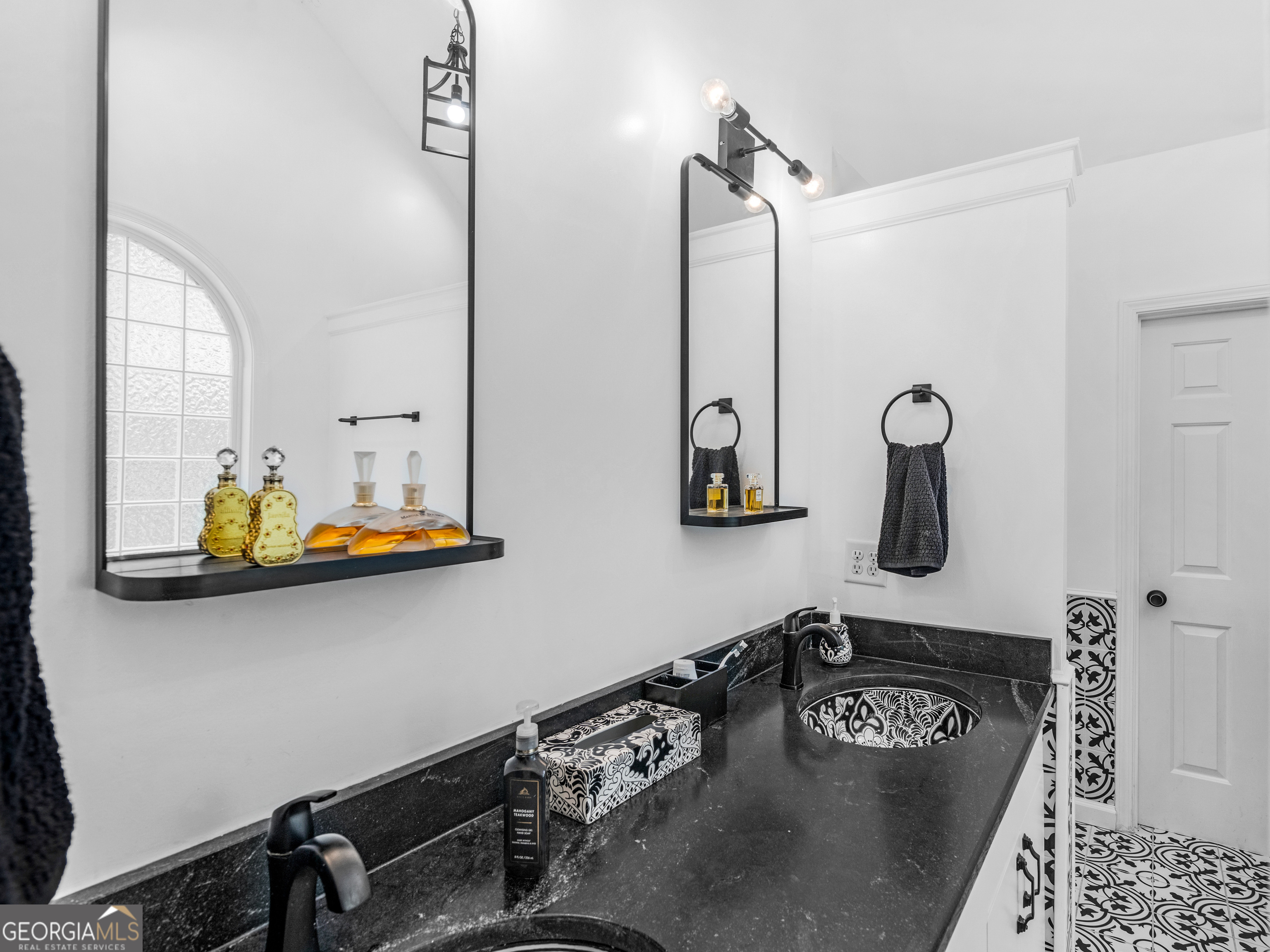 545 Barhams Ridge Drive McDonough, GA 30252 - Photo 28 of 55 a bathroom with a sink and a mirror
