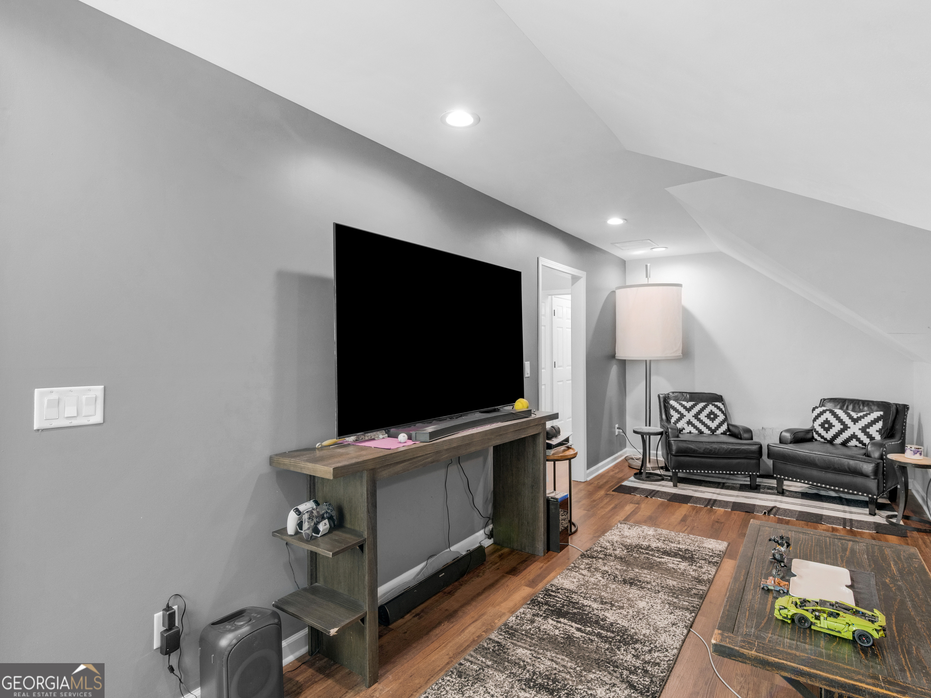 545 Barhams Ridge Drive McDonough, GA 30252 - Photo 33 of 55 a living room with furniture and a flat screen tv