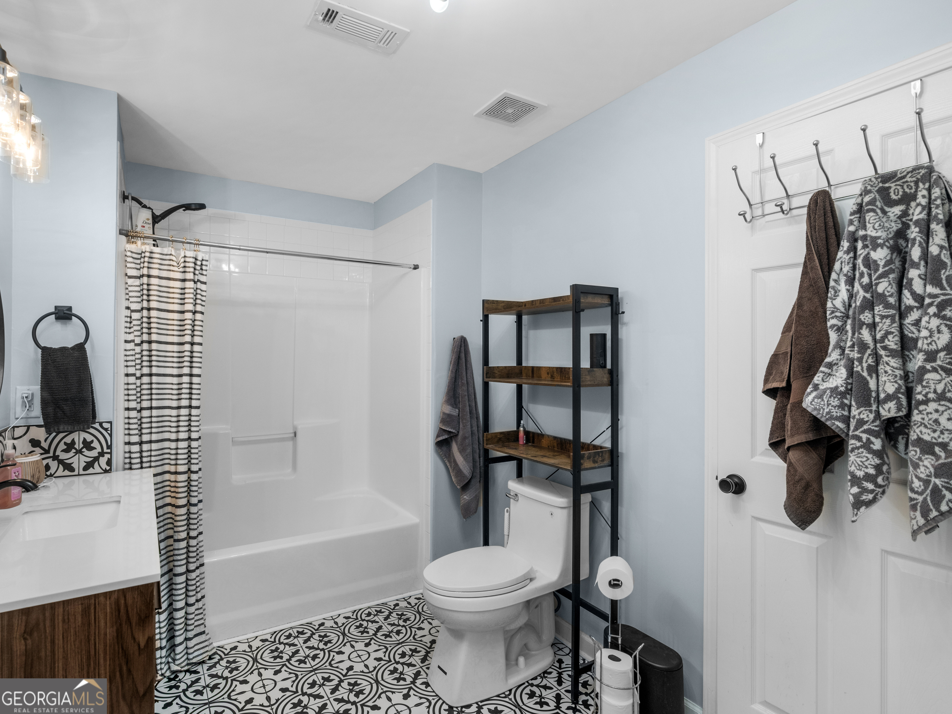 545 Barhams Ridge Drive McDonough, GA 30252 - Photo 36 of 55 a bathroom with a toilet sink and shower