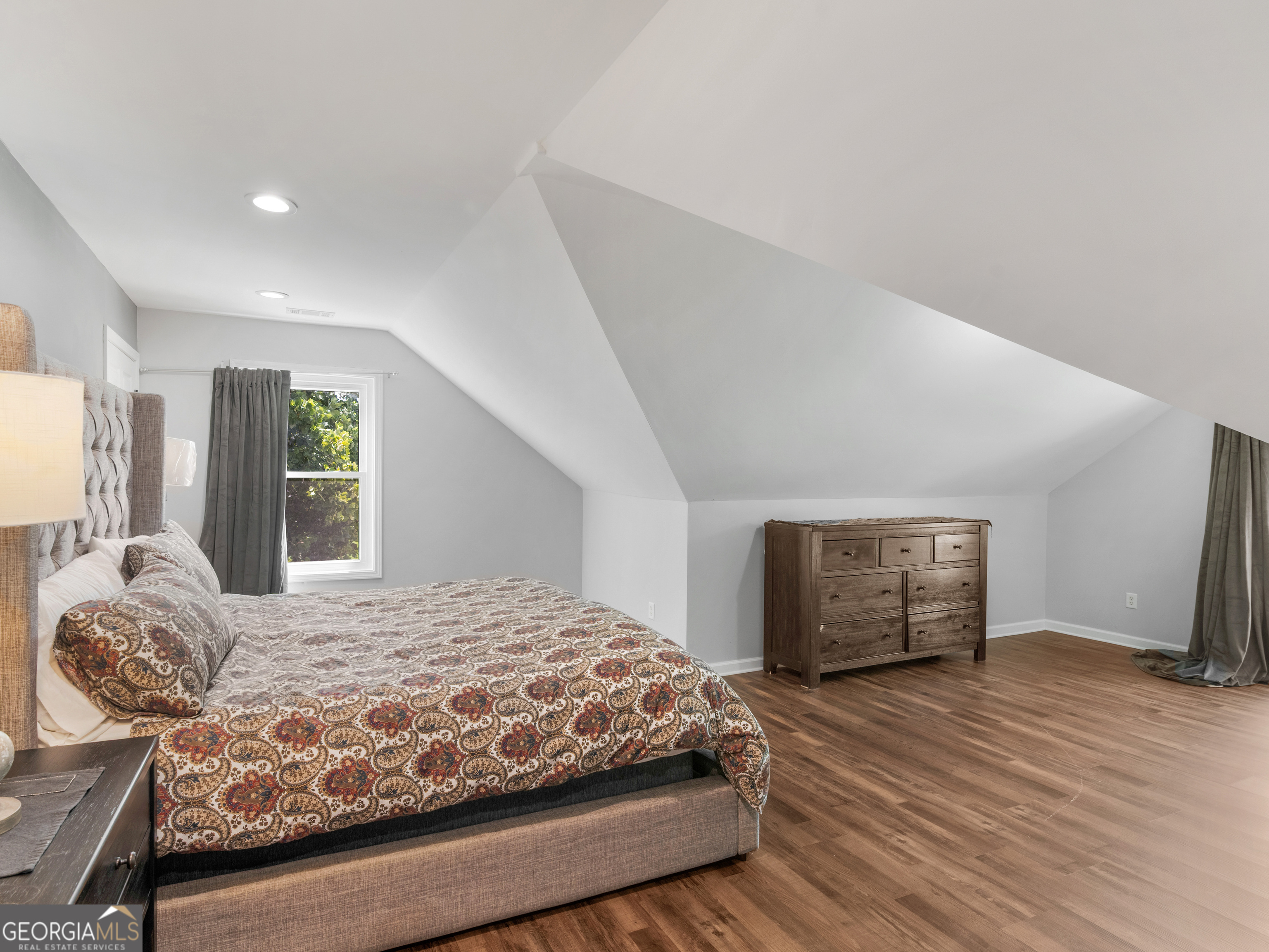545 Barhams Ridge Drive McDonough, GA 30252 - Photo 39 of 55 a bedroom with a large bed and a window
