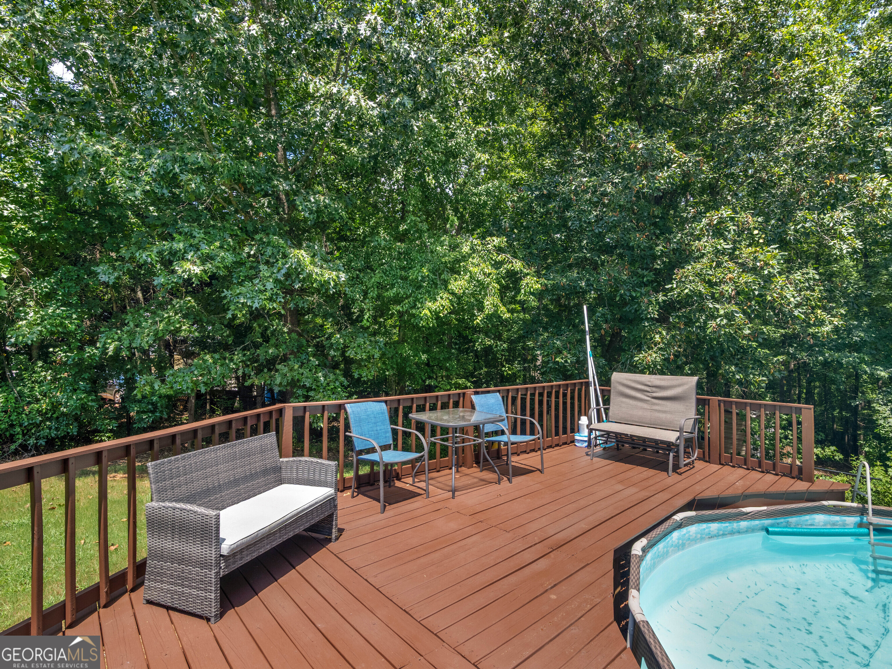 545 Barhams Ridge Drive McDonough, GA 30252 - Photo 4 of 55 a view of a roof deck with chair and wooden floor