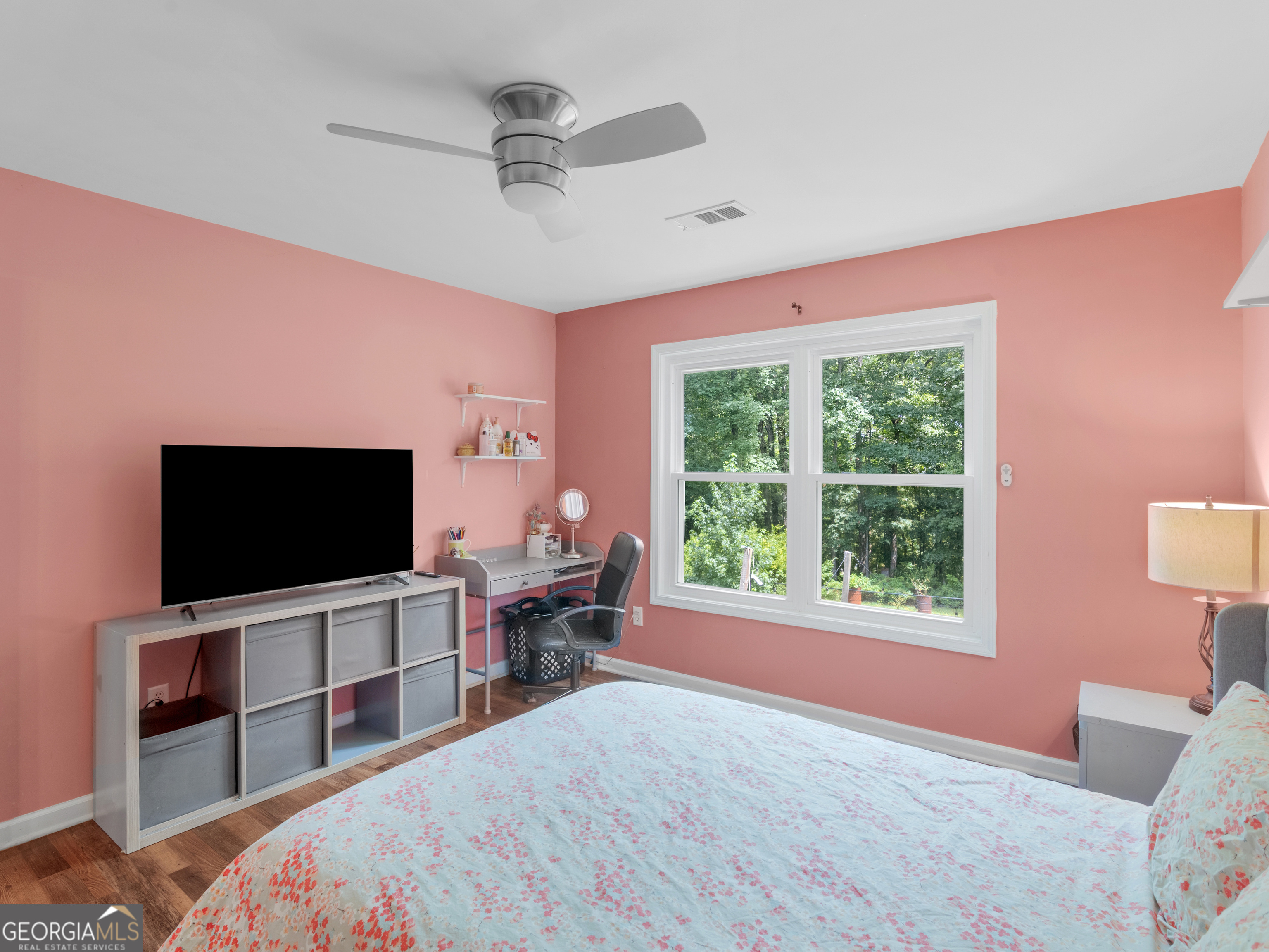545 Barhams Ridge Drive McDonough, GA 30252 - Photo 41 of 55 a bedroom with a bed and a flat screen tv