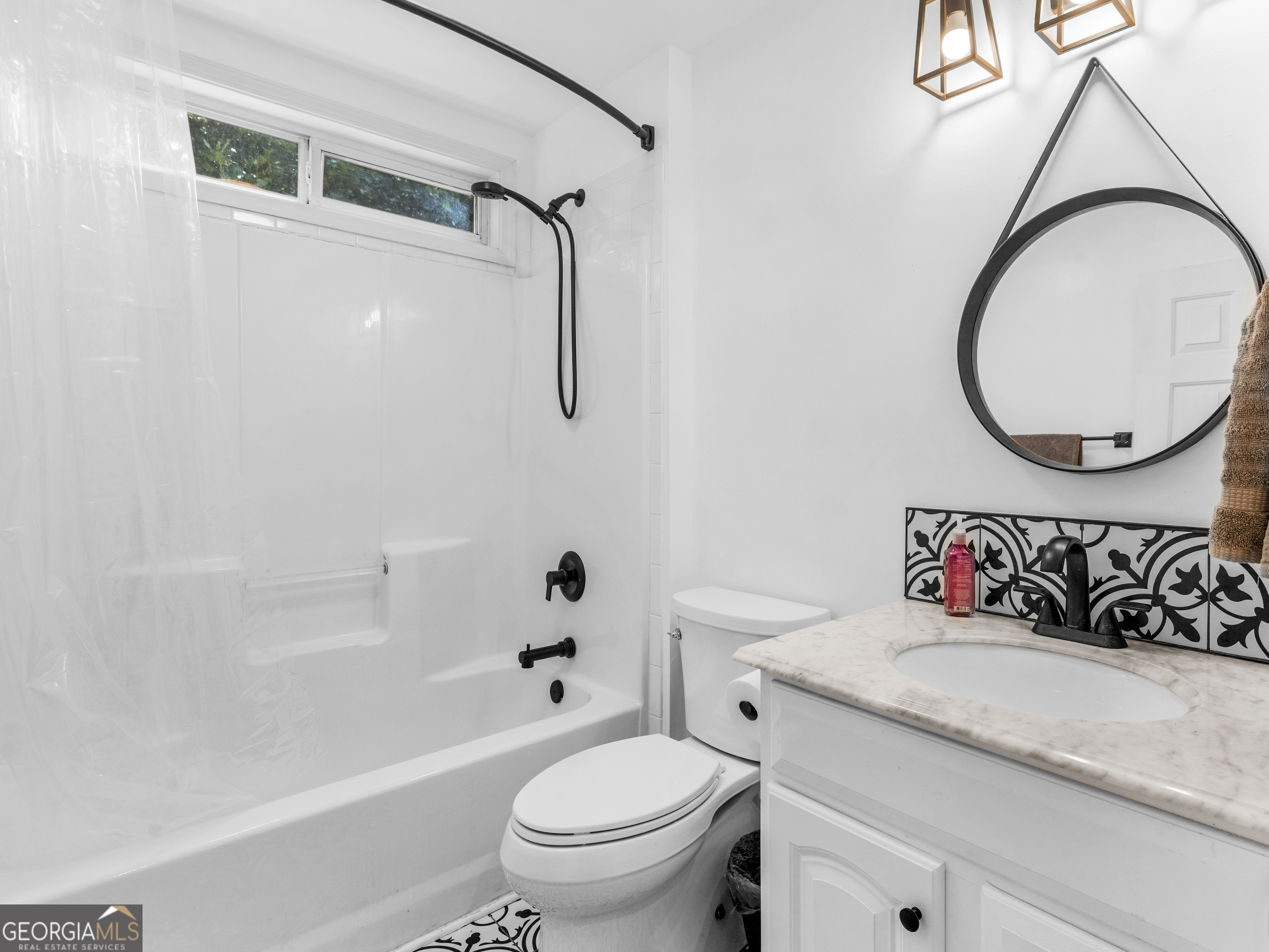 545 Barhams Ridge Drive McDonough, GA 30252 - Photo 43 of 55 a bathroom with a toilet a sink and a bathtub