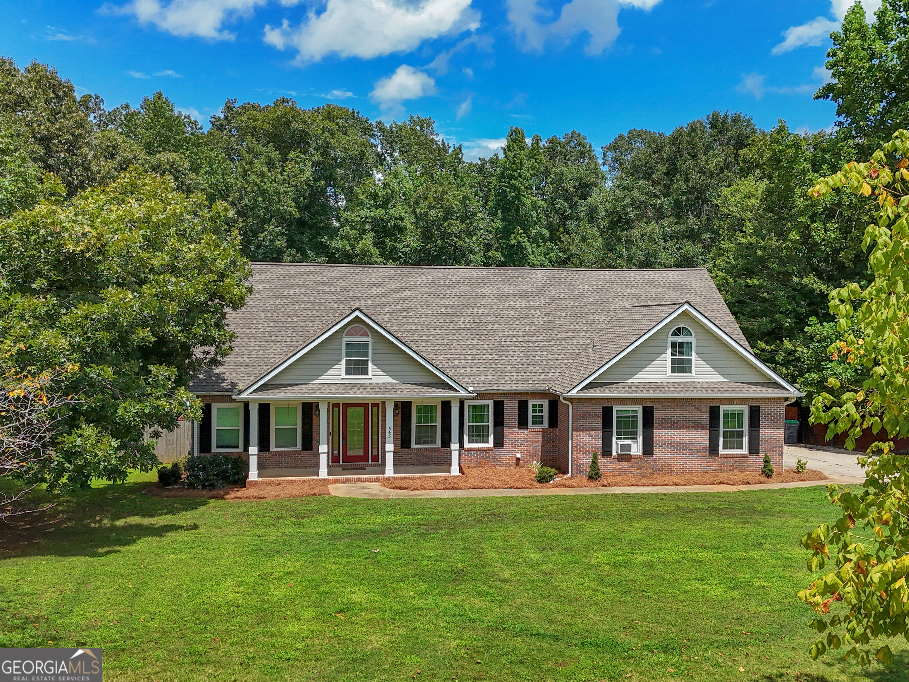 545 Barhams Ridge Drive McDonough, GA 30252 - Photo 52 of 55 a front view of a house with a garden
