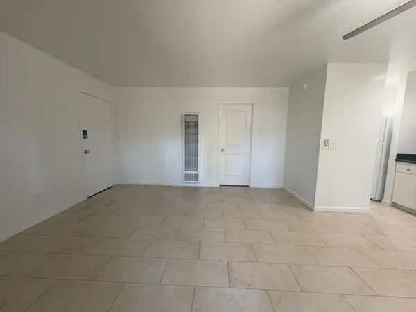 a view of an empty room and entryway