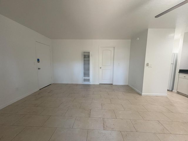 a view of an empty room and entryway