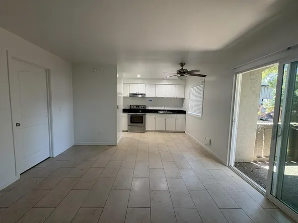 a large kitchen with cabinets and a stove