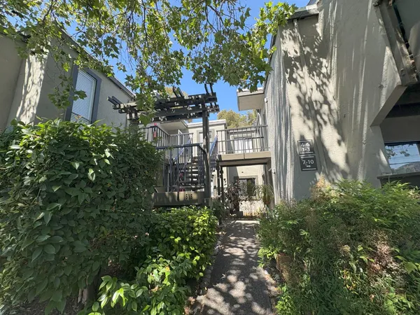 a view of a building with a tree