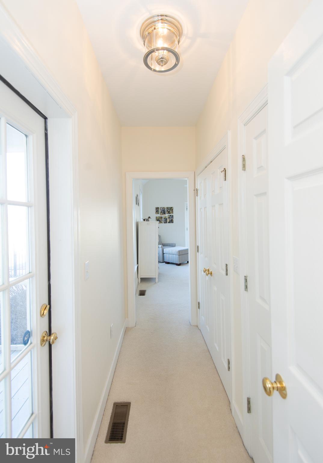 5018 Rippling Road Cambridge, MD 21613 - Photo 33 of 101 Primary closet space and private entry to porch