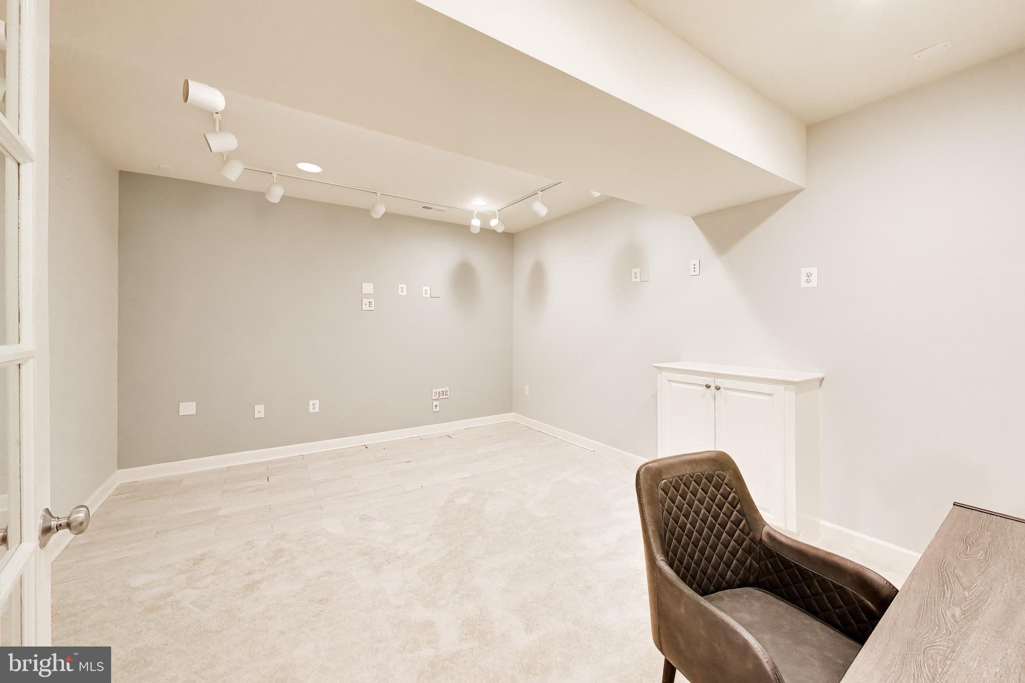 13513 Moonlight Trail Drive Silver Spring, MD 20906 - Photo 51 of 78 a view of a room with furniture and wooden floor