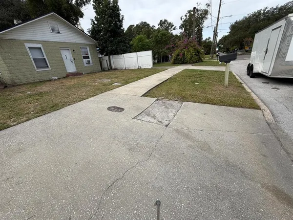 a view of a house with a yard