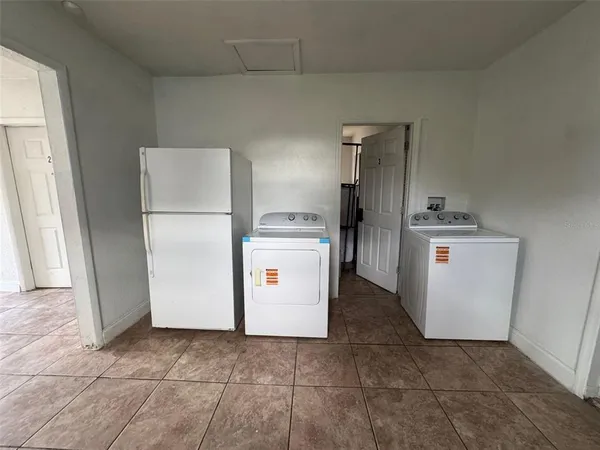 a utility room with washer and dryer