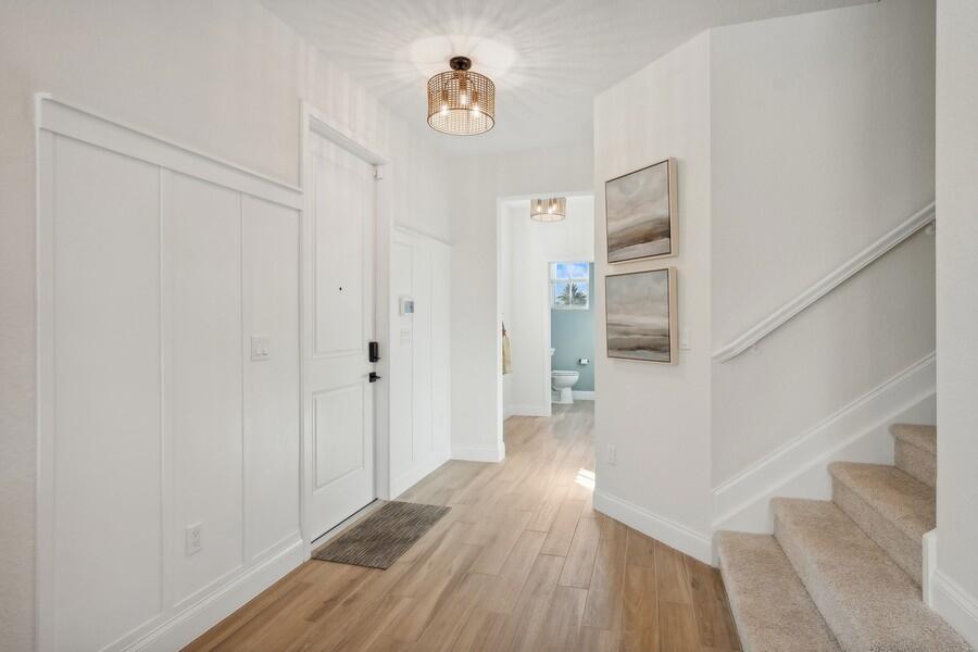 128 Southeast Birch Terrace, Unit 1579 Stuart, FL 34997 - Photo 2 of 44 a view of entryway with wooden floor