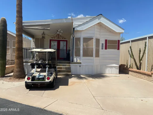 a view of a patio with table and chairs and potted plants
