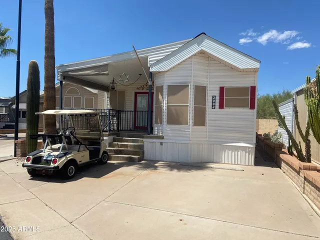 a front view of a house with parking space