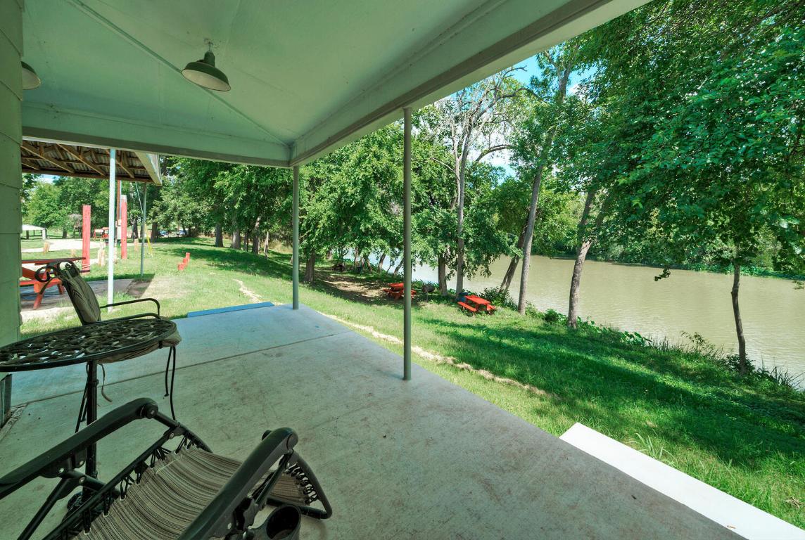 906 Water Street Manor, TX 78653 - Photo 11 of 22 a view of a chair and tables in the garden