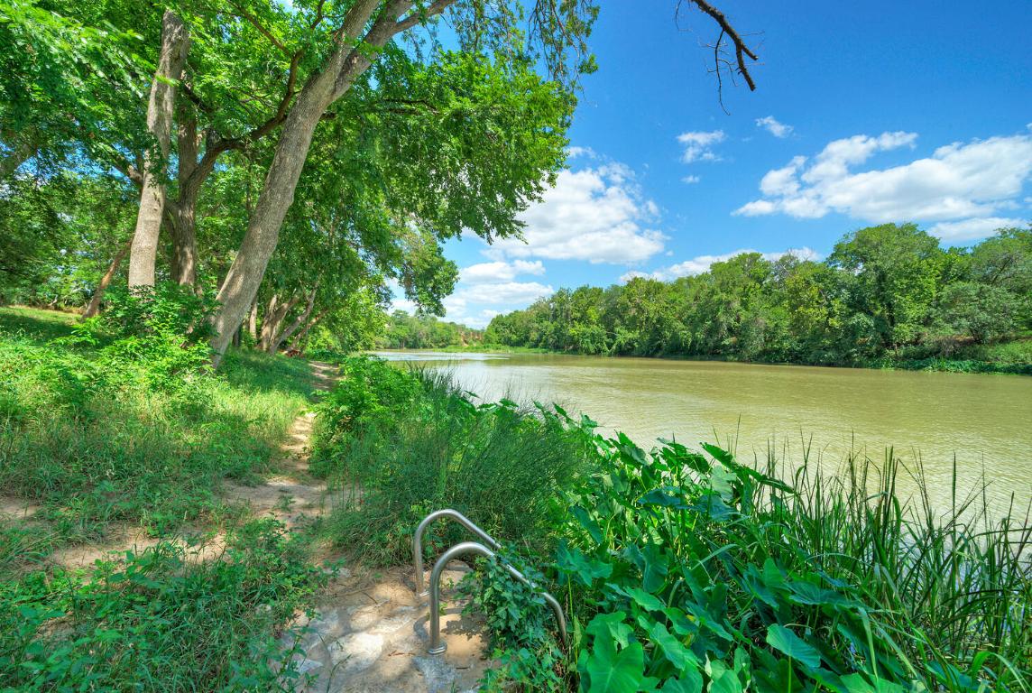 906 Water Street Manor, TX 78653 - Photo 13 of 22 a view of a lake view with a garden