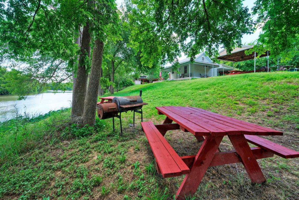 906 Water Street Manor, TX 78653 - Photo 14 of 22 a view of a backyard with sitting area