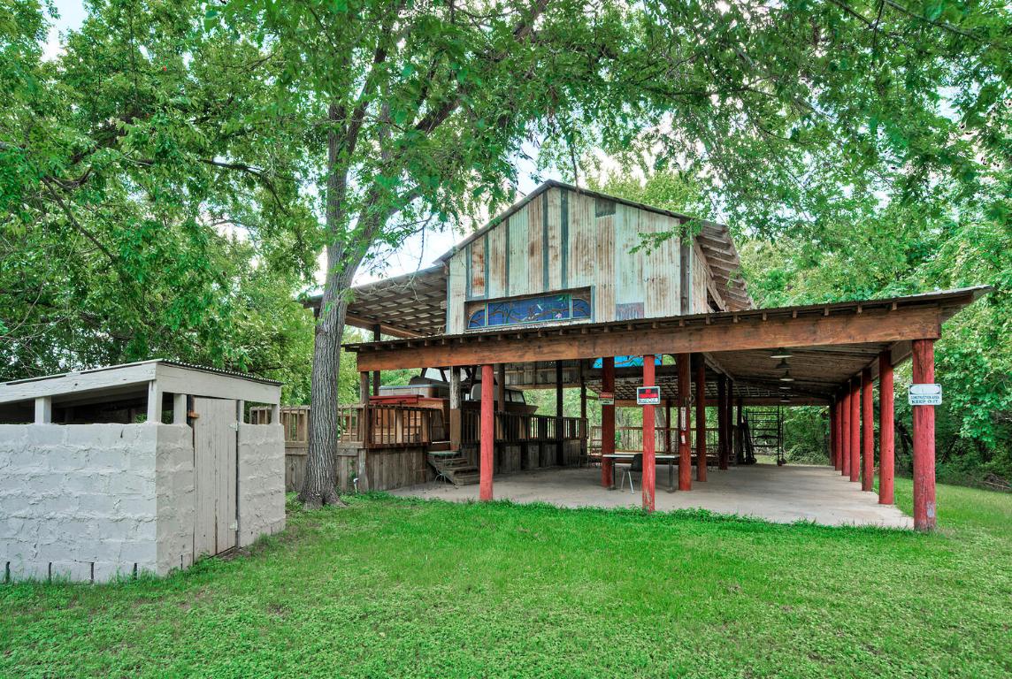 906 Water Street Manor, TX 78653 - Photo 15 of 22 a view of a chairs and tables in the back yard