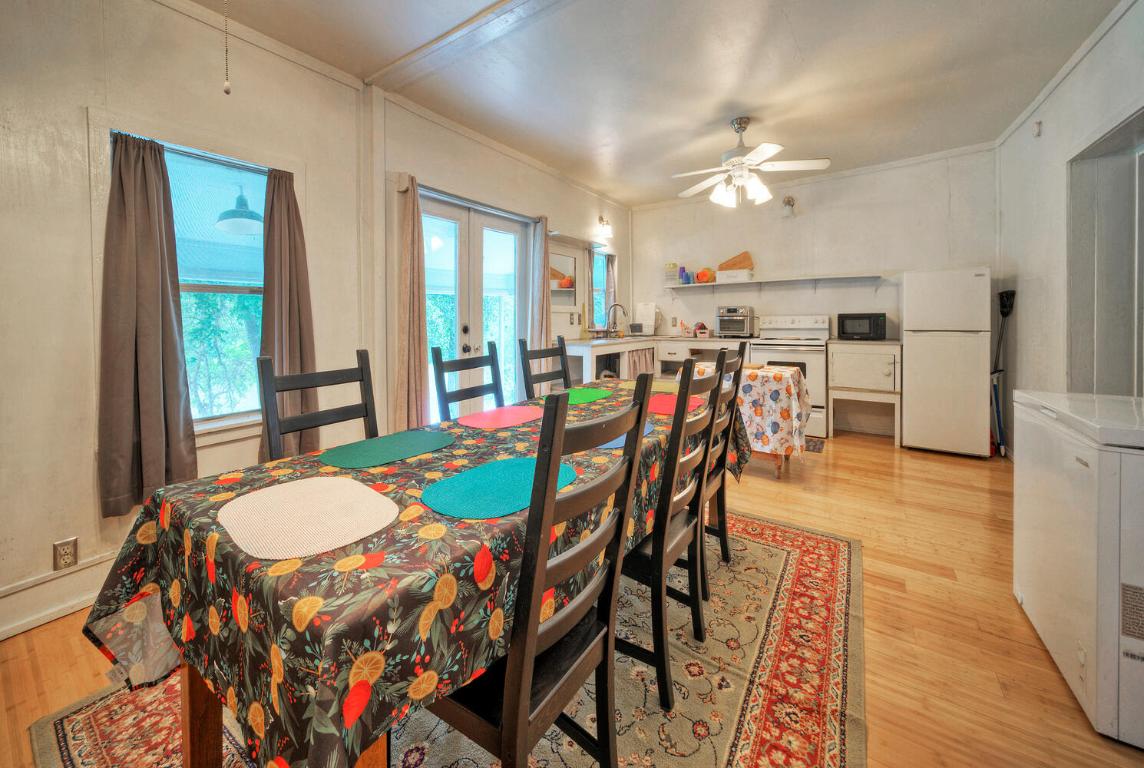 906 Water Street Manor, TX 78653 - Photo 9 of 22 a view of a dining room with furniture and wooden floor