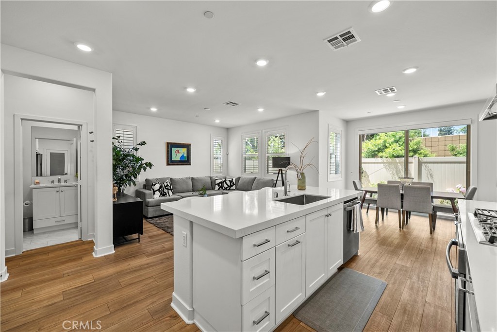 1663 Rosewell Road West Covina, CA 91791 - Photo 5 of 45 an open kitchen with a table and chairs