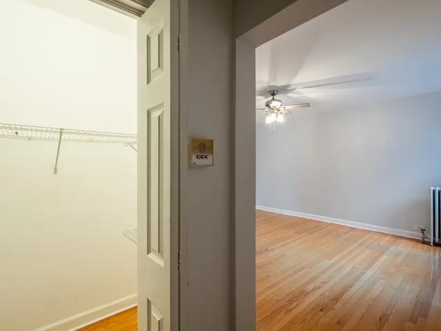 a view of a room with wooden floor