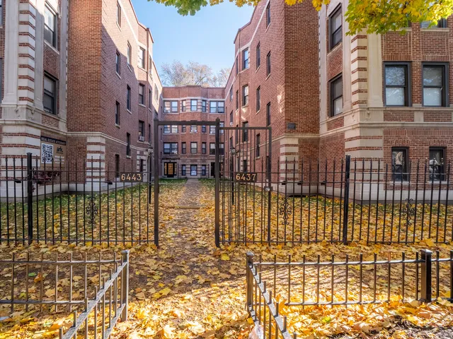 a building with swimming pool and glass door