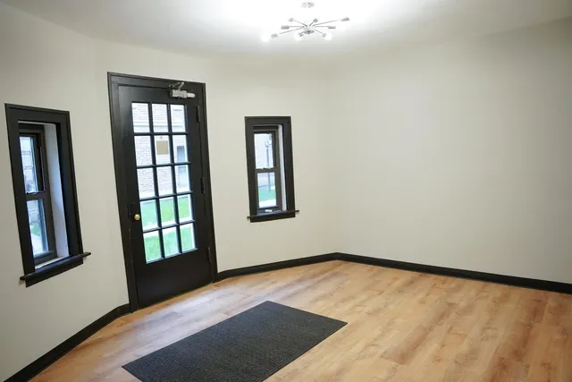 a view of an empty room with a window