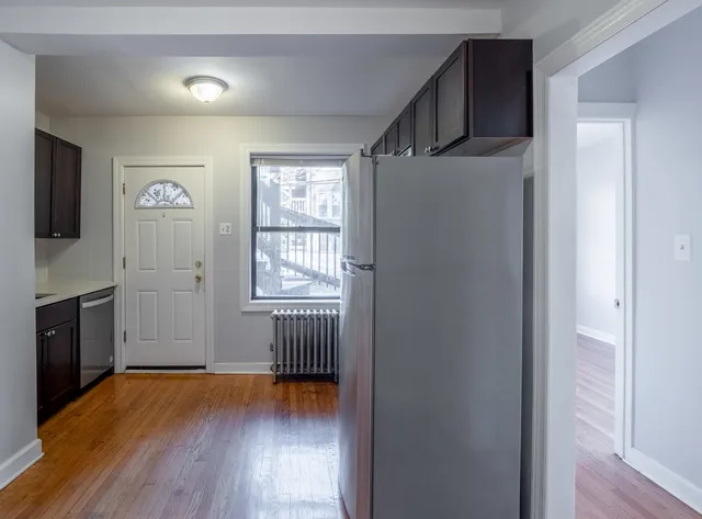 a view of a livingroom with an empty space and a window