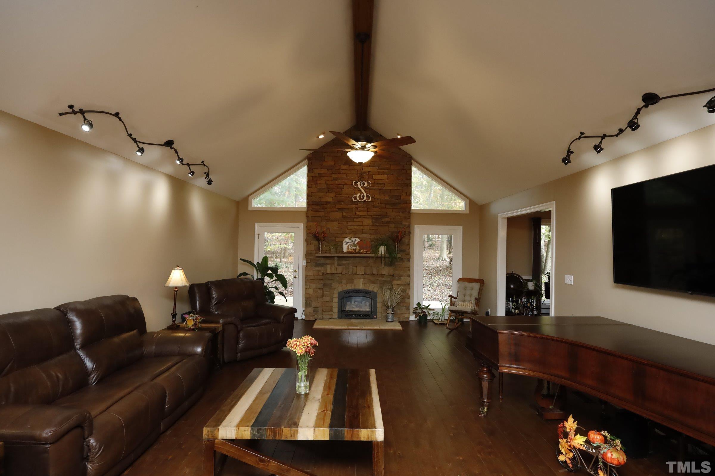 10904 Brass Kettle Road Raleigh, NC 27614 - Photo 12 of 41 a living room with furniture fireplace and flat screen tv