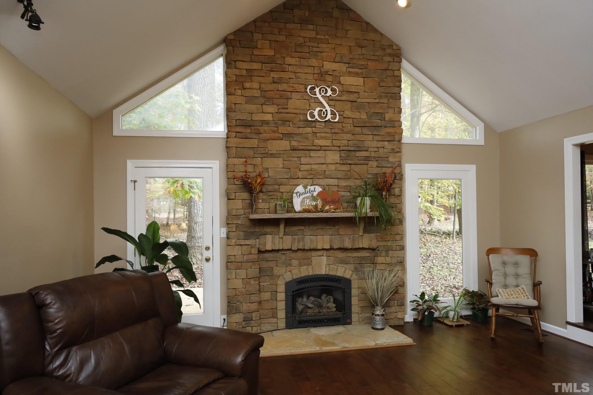 10904 Brass Kettle Road Raleigh, NC 27614 - Photo 13 of 41 a living room with furniture and a fireplace
