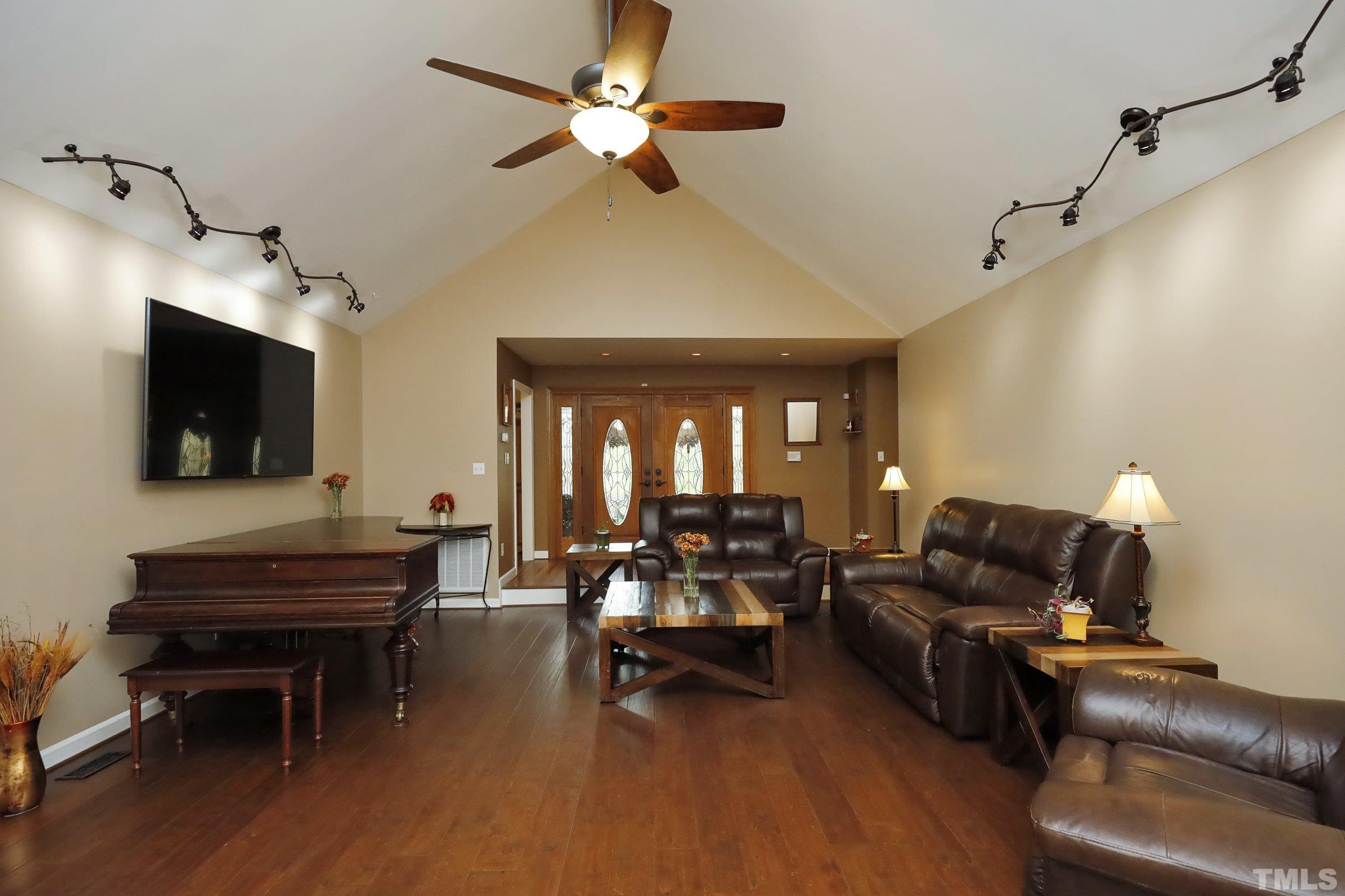 10904 Brass Kettle Road Raleigh, NC 27614 - Photo 14 of 41 a living room with furniture and a flat screen tv