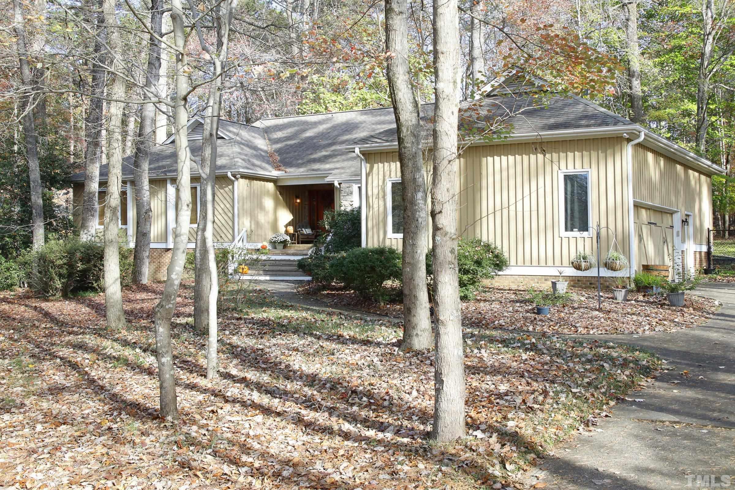 10904 Brass Kettle Road Raleigh, NC 27614 - Photo 2 of 41 a view of a house with a tree in front